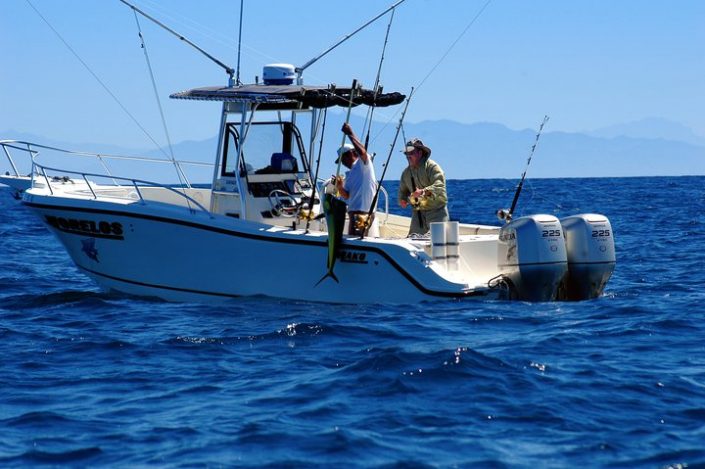 Fishing in Riviera Nayarit Mexico - image of man pulling in his catch