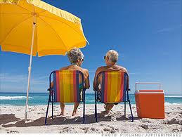 Couple sitting beside beach umbrella in Riviera Nayarit MX