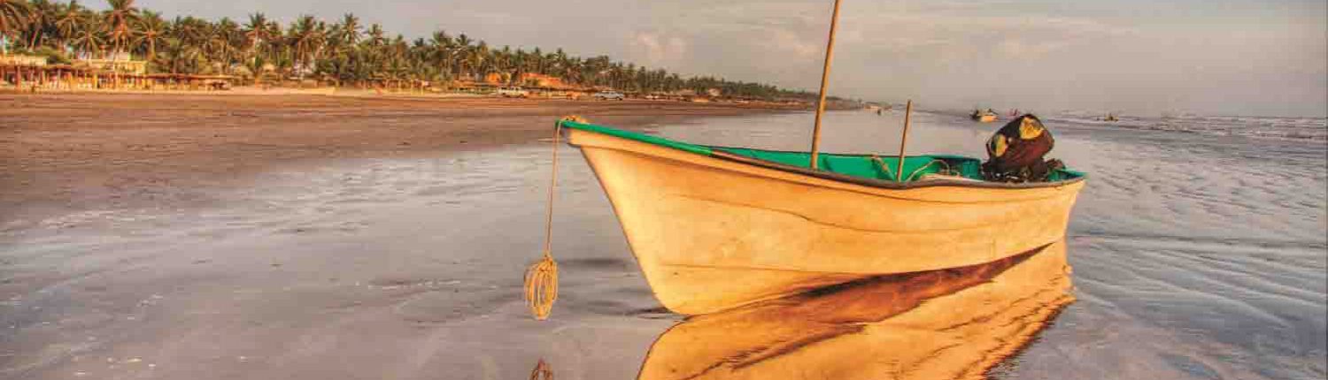 Small boat on the beach in Novillero Riviera Nayarit Mexico