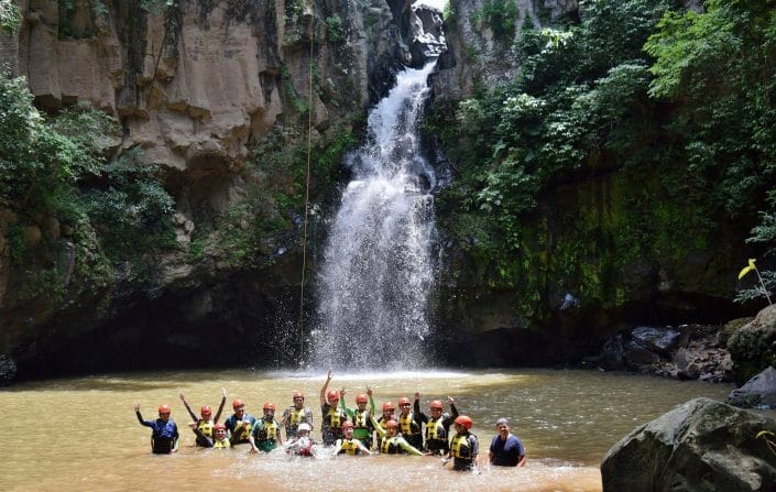 Rappelling in Riviera Nayarit Mexico - image of rappelling group in pool below waterfalls