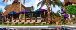 Poolside lawn chairs at Villa Bella Hotel in La Cruz de Huanacaxtle Riviera Nayarit Mexico